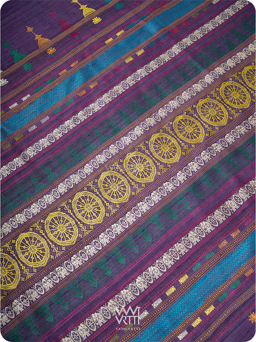 Pallu detail with lotus flowers handwoven in multiple colors on deep baingani tussar