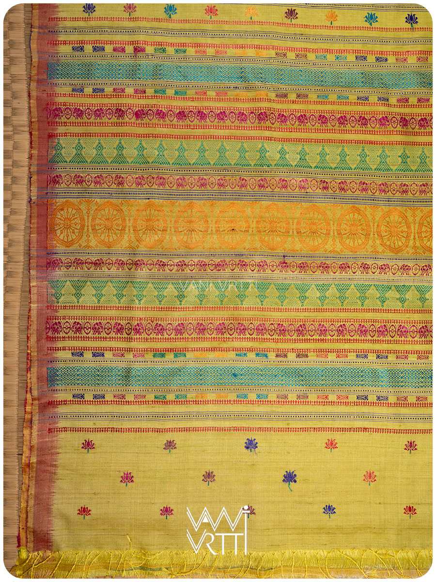 Pallu of banana leaf green Konark saree with handwoven lotus flowers in multiple colors