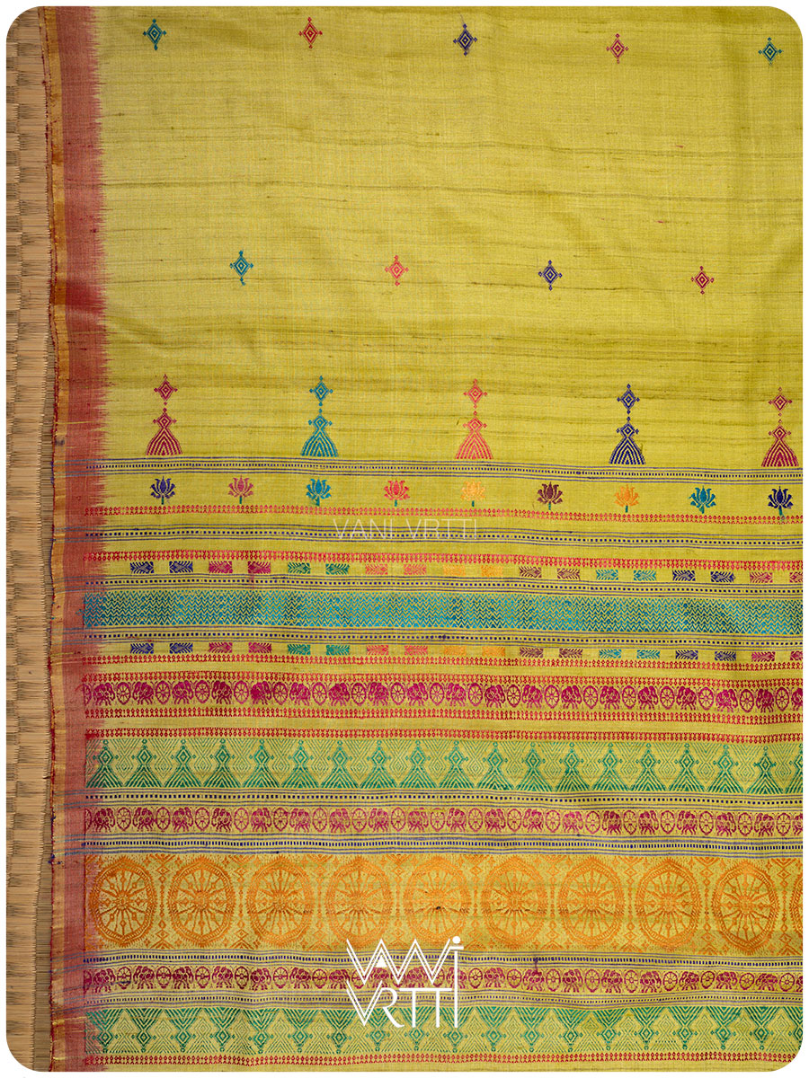 Body of banana leaf green tussar silk saree with Airavata buttis across the weave
