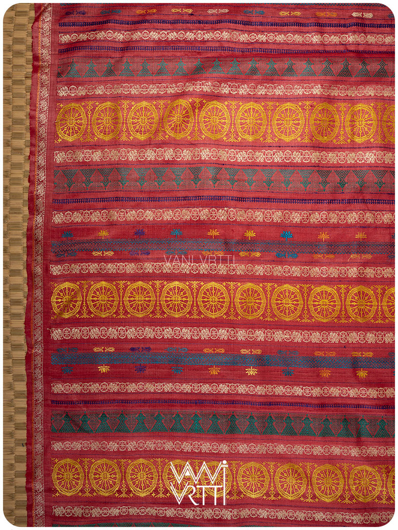 Pallu of peach red saree featuring handwoven lotus flowers and Airavata elephant border