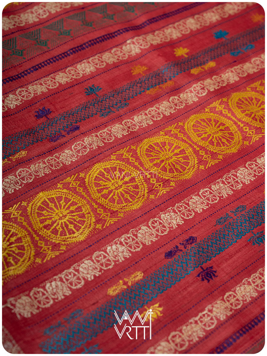 Pallu close up showing handpicked lotus flowers in multiple colors on peach red tussar