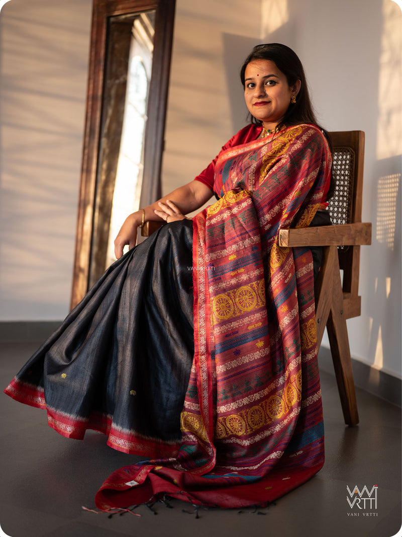 Slate black tussar silk Konark saree with Airavata elephant border, worn by model